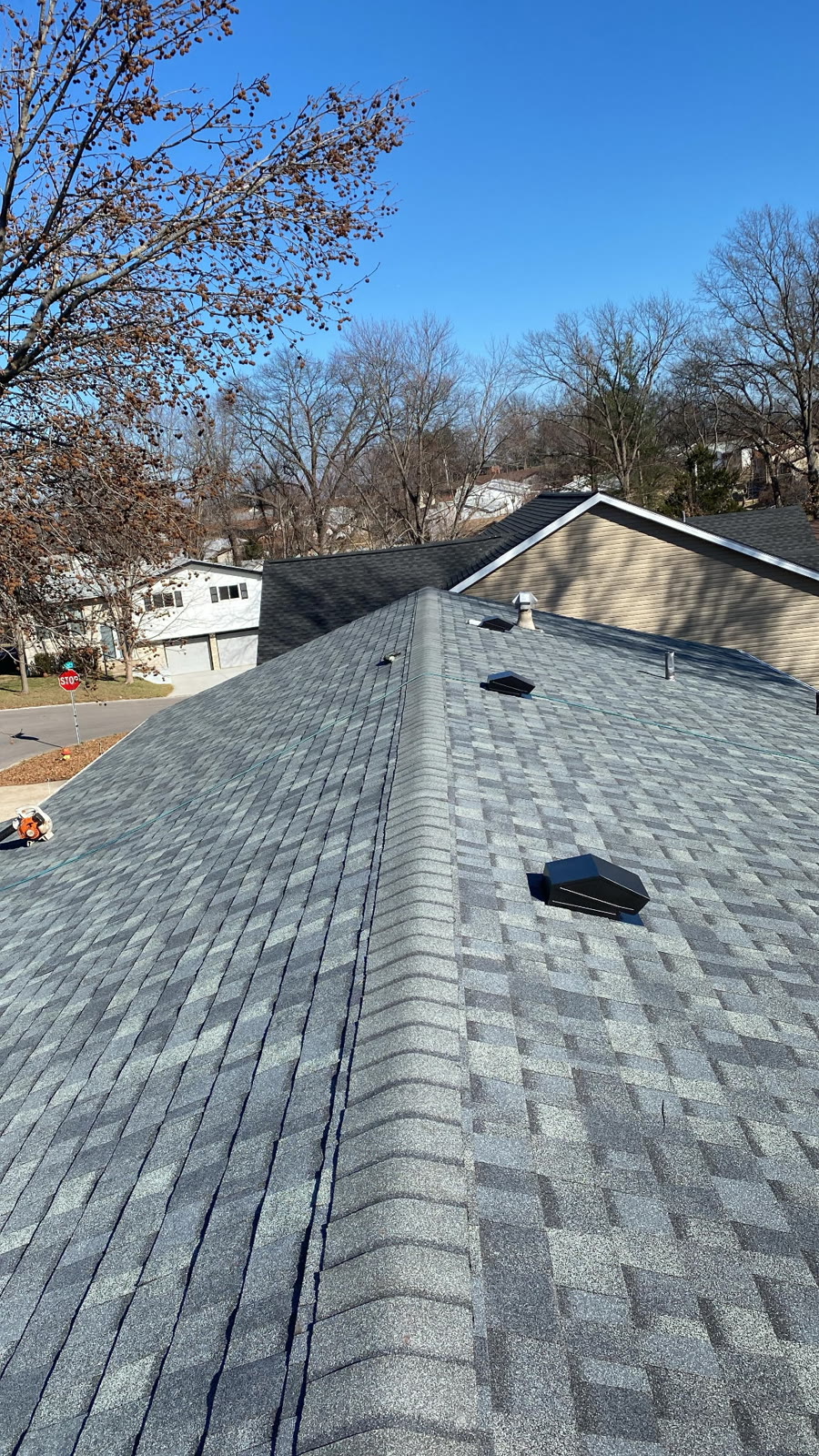 New gray architectural shingle roof installed by LJC Construction