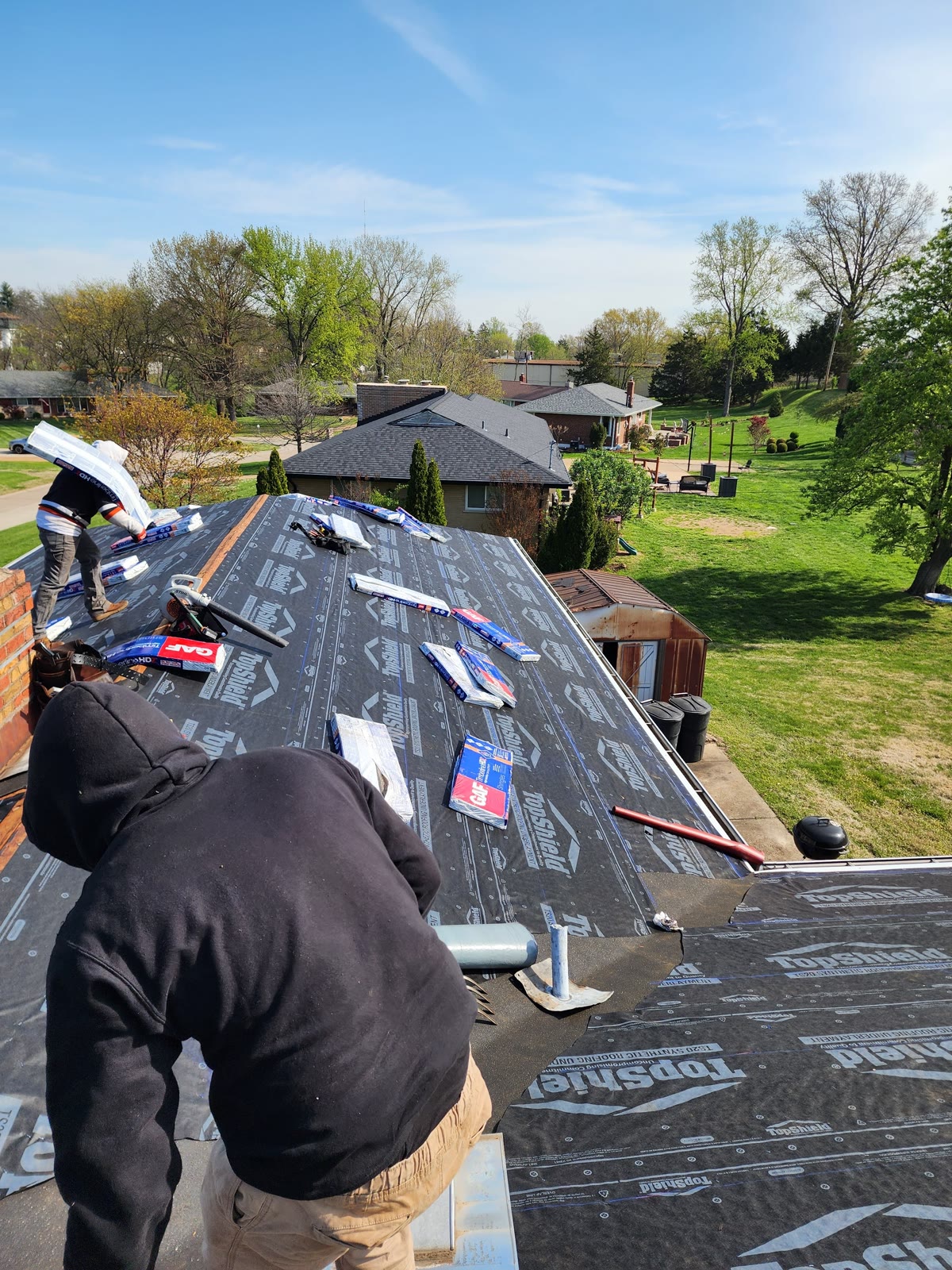LJC crew laying roofing underlayment