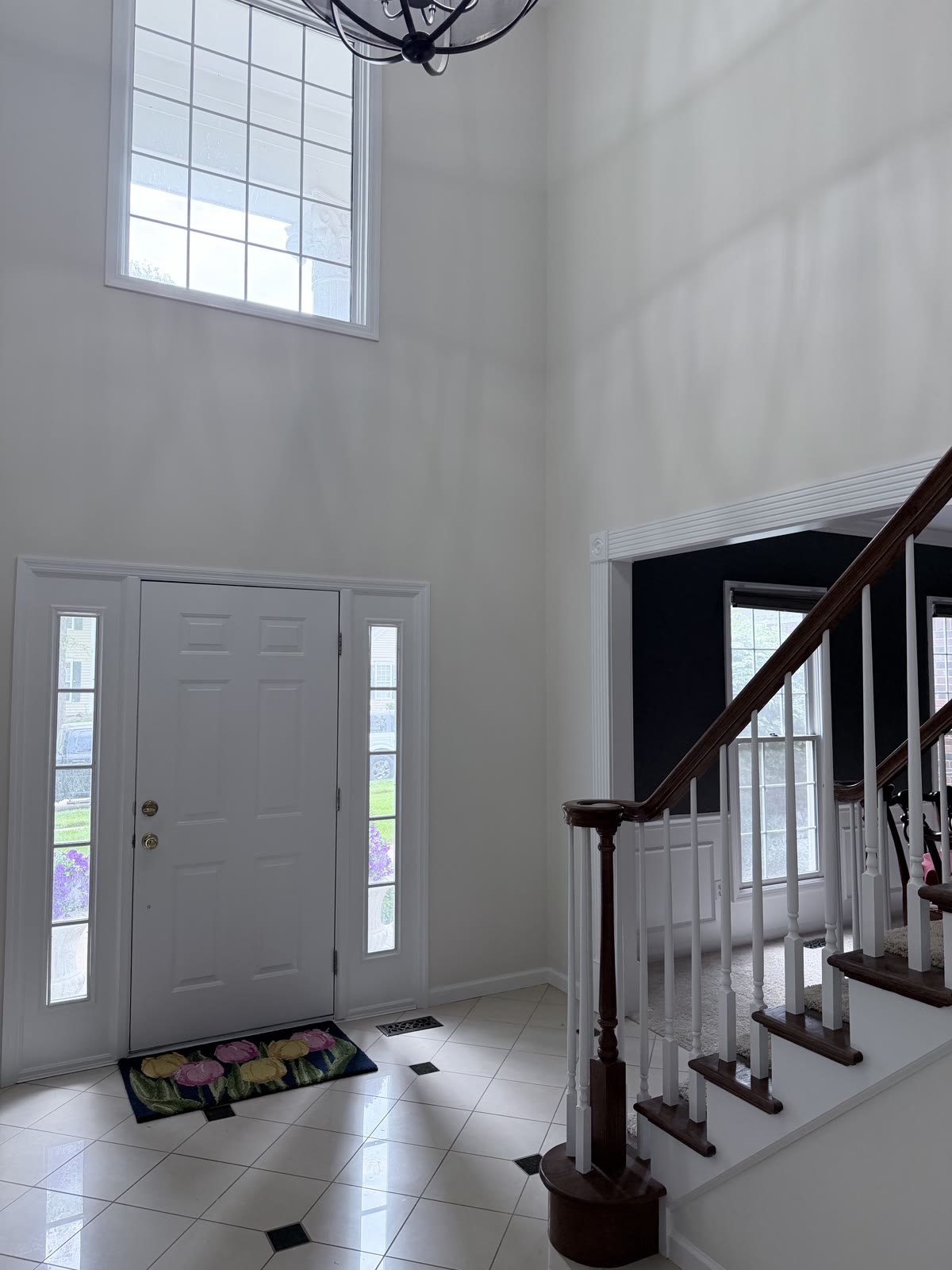Freshly painted foyer with wood staircase