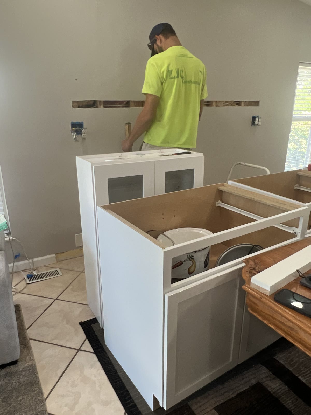White shaker kitchen cabinet installation by LJC Construction