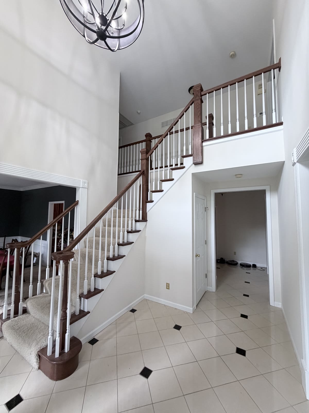 Wood staircase with white spindles and fresh paint