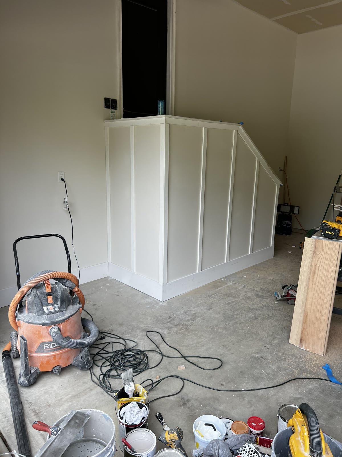 Under-stair wainscoting installation in progress